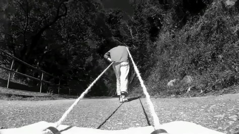 上一座山, 磨一面鏡, 2016作品藉着行山路徑，磨走一面鏡，目的是在大自然行走中消融自我。 脫去圍牆迎接世界。 By hiking, the artist rubbed away a piece of mirror, aim at melting himself into the nature, getting out of the walls and welcoming the world. 上一座山 在草原，上一座山。 在山腳下，總是存在渴望； 由邊界穿越邊界。 由人群走到另一群人。 上一座山, 磨走一面鏡 放下一些重量， 換取一首歌 在同一海拔上的交流 。 沒有累積，只留下痕跡 他們叫這地做俱樂部，我們叫樂園。